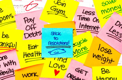 5 New Year's Resolution with multiple sticky notes on a calendar with Jan 1st circled