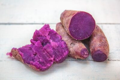 purple sweet potatoes on a white background
